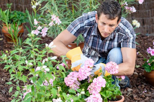 Gardening team following safety practices during outdoor maintenance